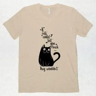 An image of a light tan T shirt with V neck that has a black silhouette of a cat that says If cats could text you back, they wouldn't