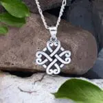 Sterling Silver Celtic Four Hearts Pendant Next to Dime