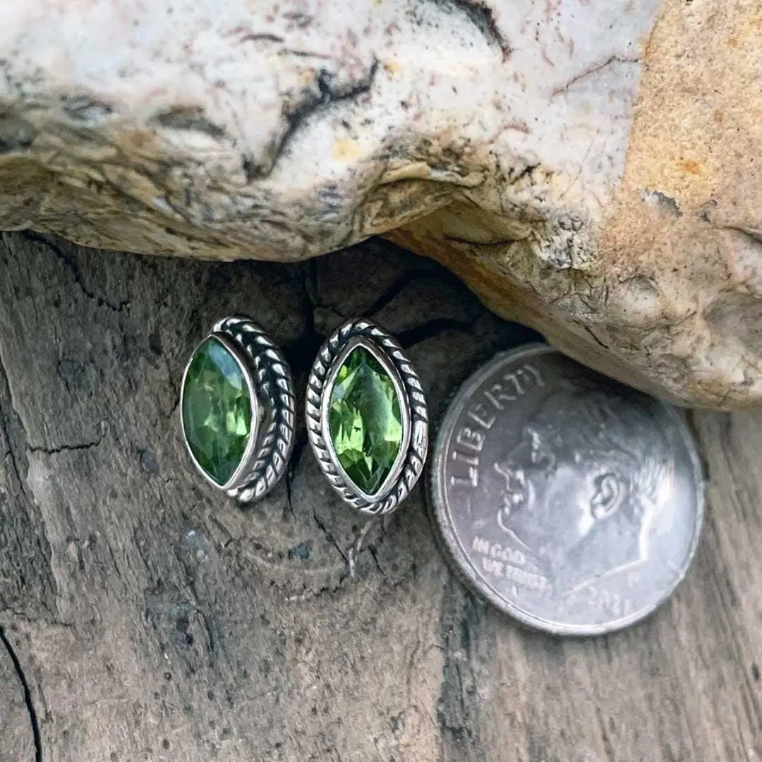 an image of a pair of Marquise Peridot and Sterling Silver Stud Earrings next to a dime