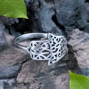 an image of a Hamsa Sterling Silver Filigree Ring that shows the hand wrapping around the front to the side.