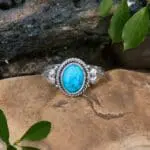 an image of an Oval Turquoise and Sterling Silver Ring with a heart on each side