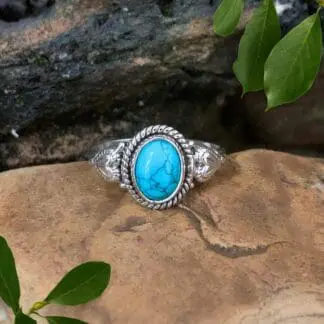 an image of an Oval Turquoise and Sterling Silver Ring with a heart on each side