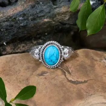 an image of an Oval Turquoise and Sterling Silver Ring with a heart on each side