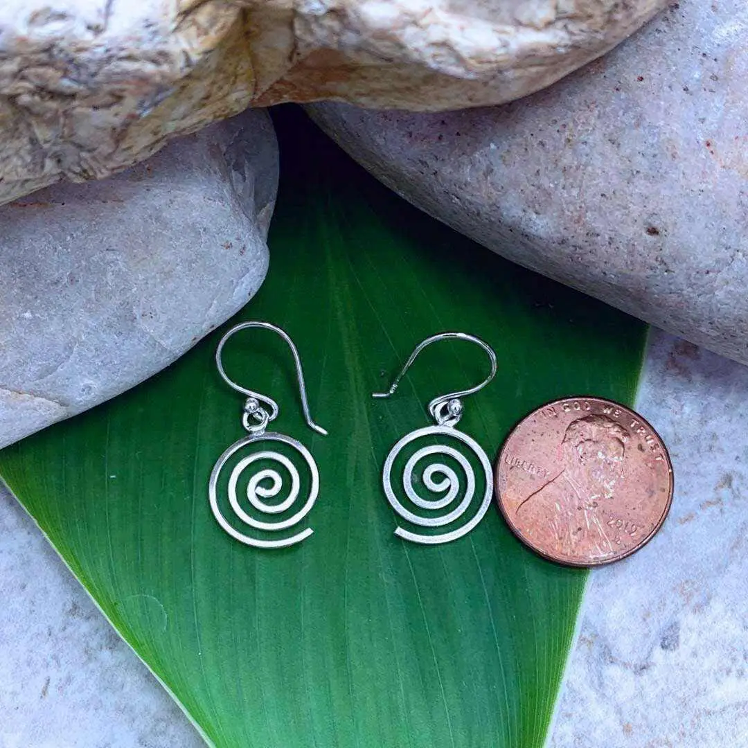 an image of a pair of Petite Sterling Silver Spiral Earrings that a very light weight with just a bit of dangle and are next to a penny