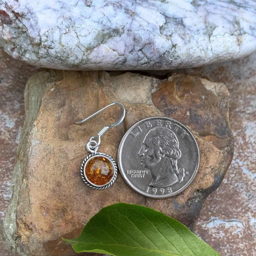 an image of a Sterling Silver and Round Amber Dangle Earring next to a quarter