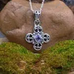 an image of a Dainty Amethyst and Sterling Silver Pendant with a diamond shaped faceted amethyst in the center