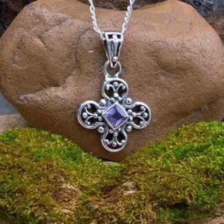 an image of a Dainty Amethyst and Sterling Silver Pendant with a diamond shaped faceted amethyst in the center