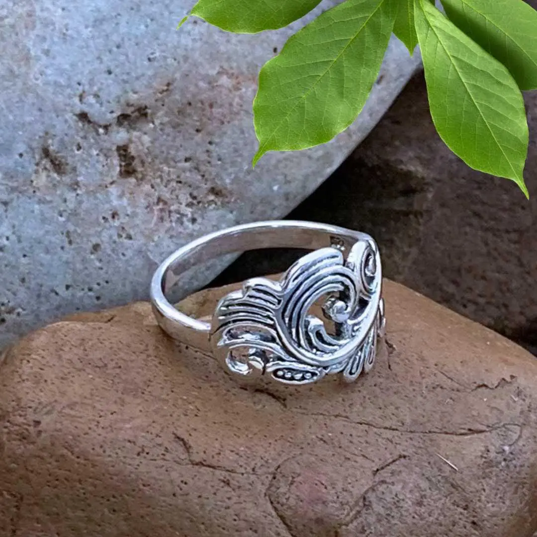 an image of a side view of what we think looks like a Sterling Angel Feather Ring
