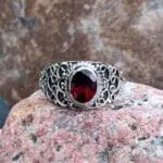 an image of an Ornate Sterling Silver and Faceted Garnet Ring