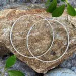 an image of a pair of Simple Sterling Silver Two Inch Continuous Hoop Earrings