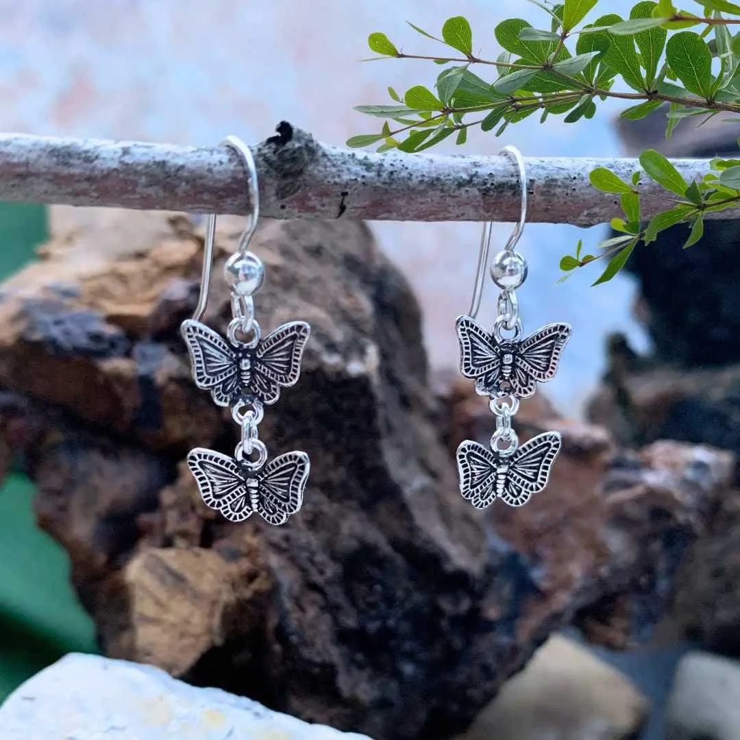 an image of a lightweight pair of Oxidized Sterling Silver Double Butterfly Dangle Earrings
