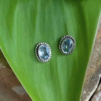 an image of a pair of oval Faceted Blue Topaz and Sterling Silver Stud Earrings
