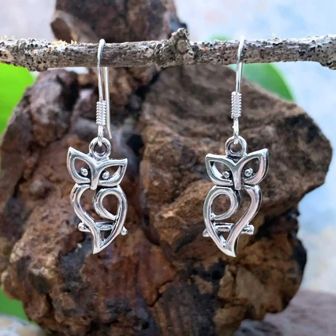 an image of an open silhouette style of owl dangle earrings