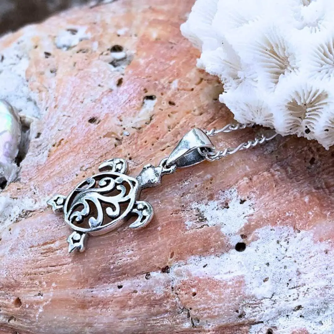 an image of a side view of a Filigree Sterling Silver Sea Turtle Pendant