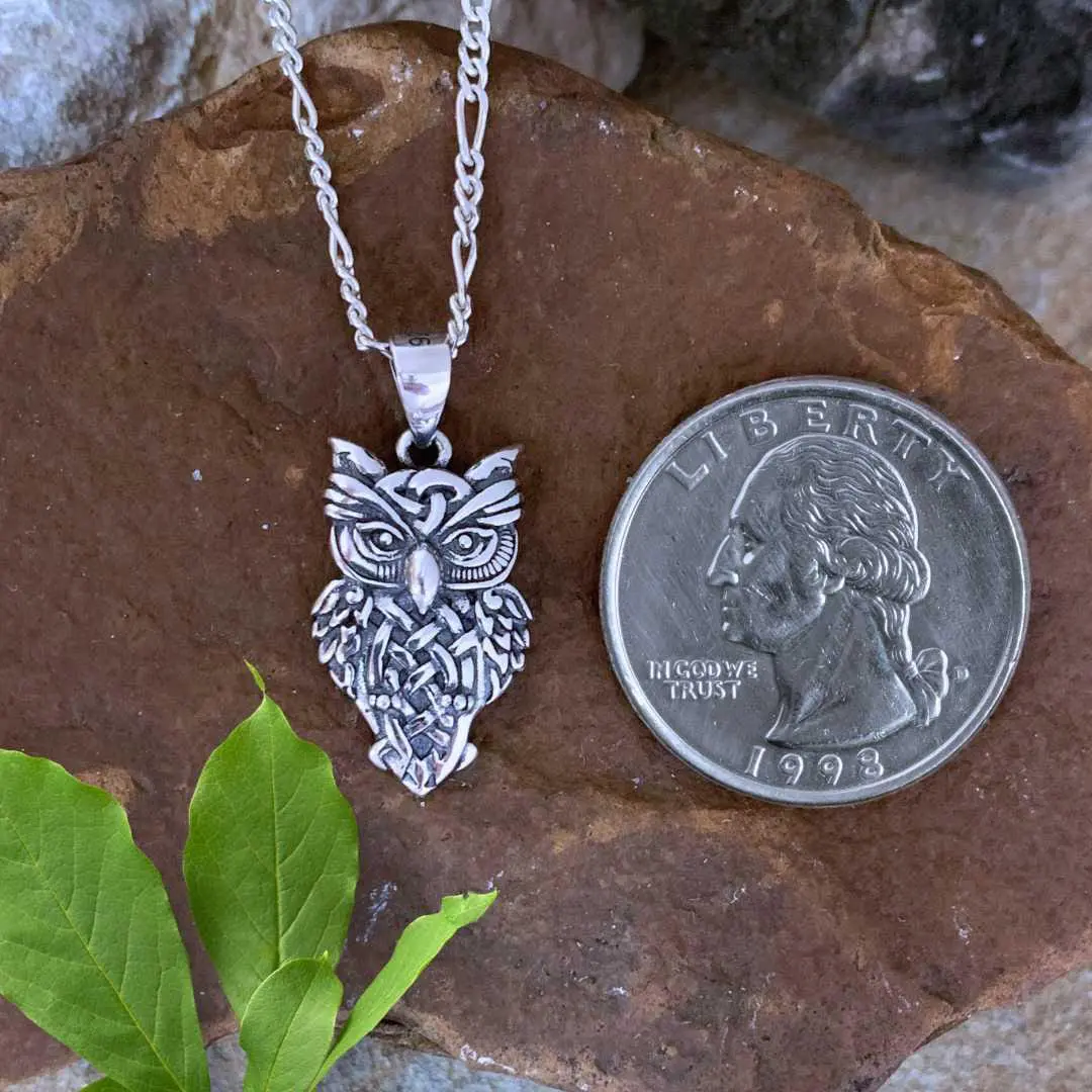 an image of a Charming Celtic Owl Sterling Silver Pendant next to a quarter