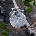 an image of a pair of Sterling Silver Tribal Spiral Hoop Earrings