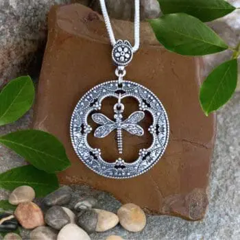 an image of a Vintage Style Sterling Silver Dragonfly Pendant with a circle and a dragonfly hanging in the center
