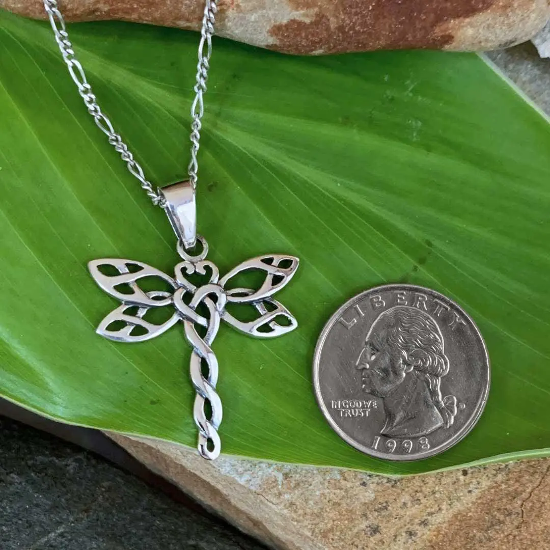 an image of a Sterling Silver Celtic Dragonfly Pendant next to a quarter