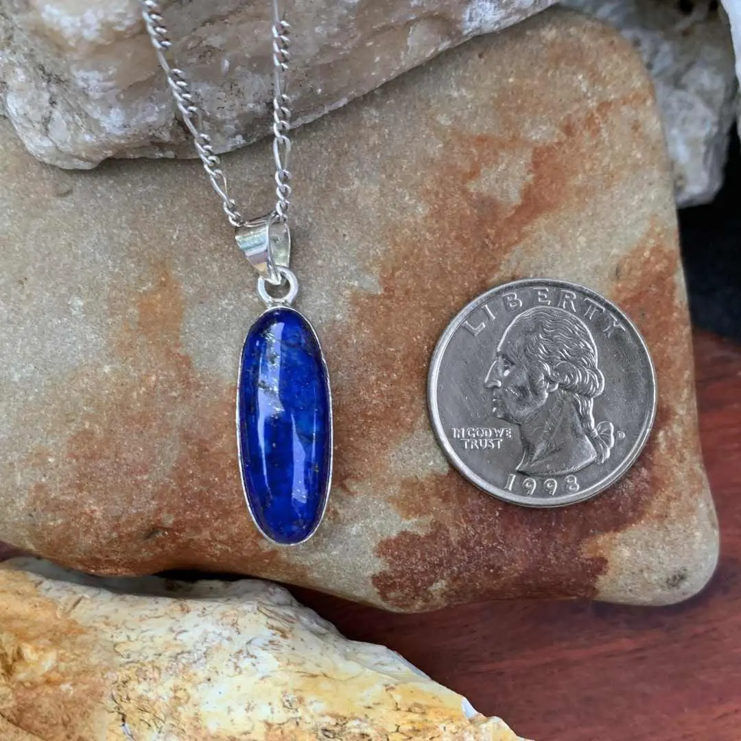 an image of an Oblong Lapis Lazuli and Sterling Silver Pendant next to a quarter