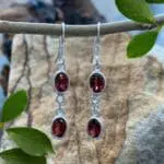 an image of a pair of Double Faceted Garnet and Sterling Silver Dangle Earrings