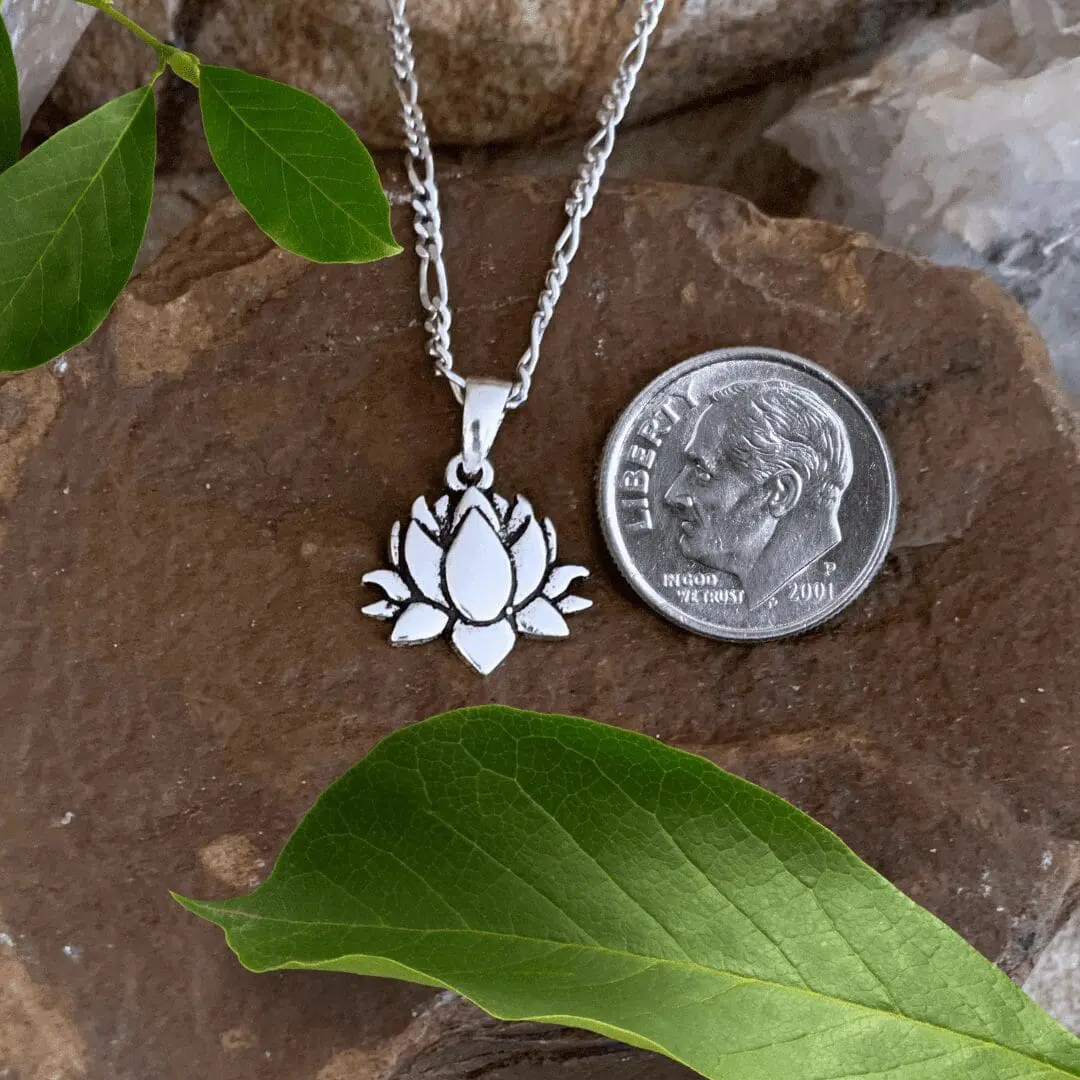 an image of an Oxidized Sterling Silver Blooming Lotus Pendant next to a dime