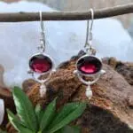 an image of a pair of Oval Garnet with tiny Pearl and Sterling Silver Earrings