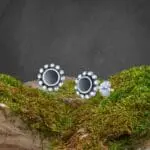 an image of a pair of Black Agate Round Sterling Silver Stud Earrings with a sterling silver beaded border
