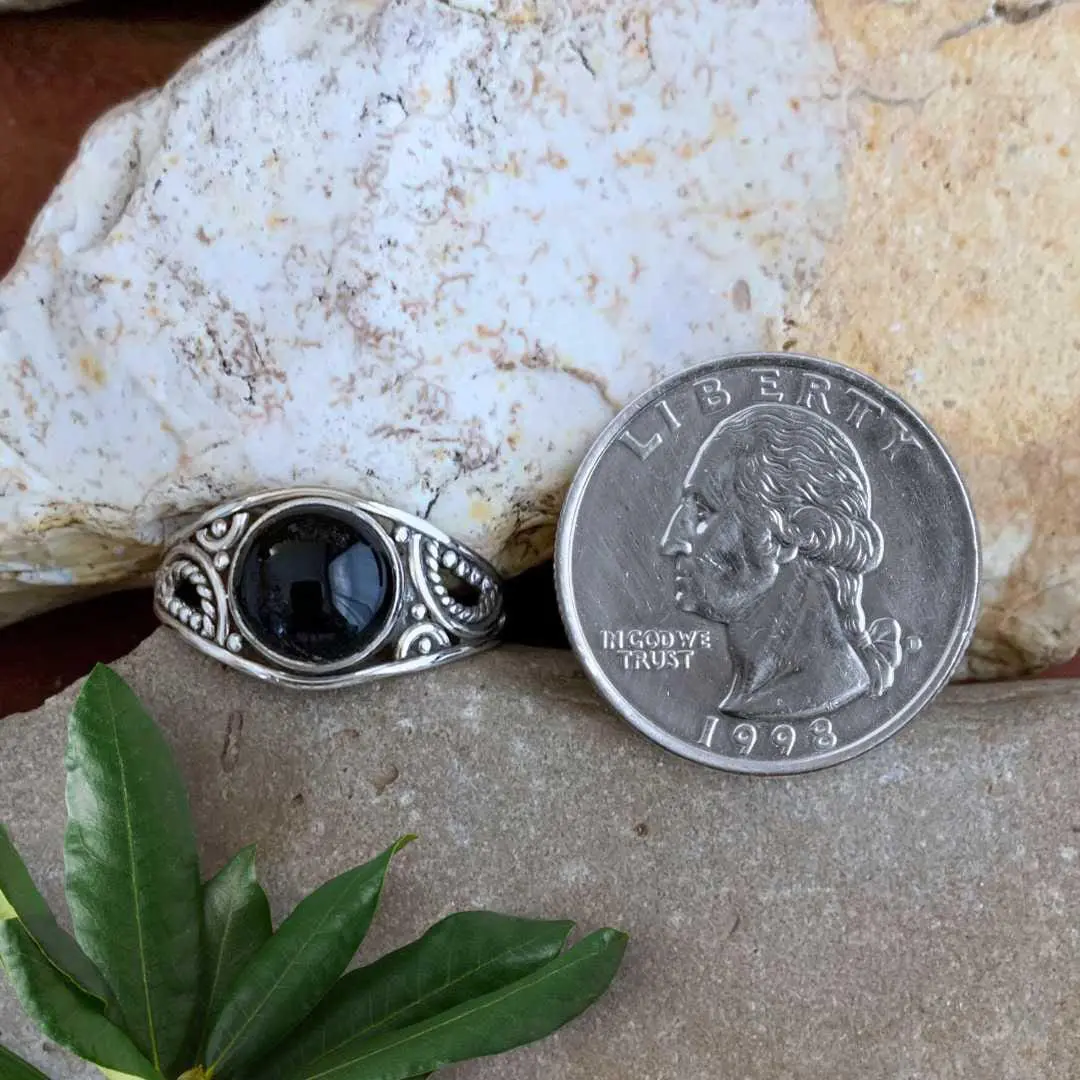 an image of a Round Black Onyx Filigree Sterling Silver Ring next to a quarter