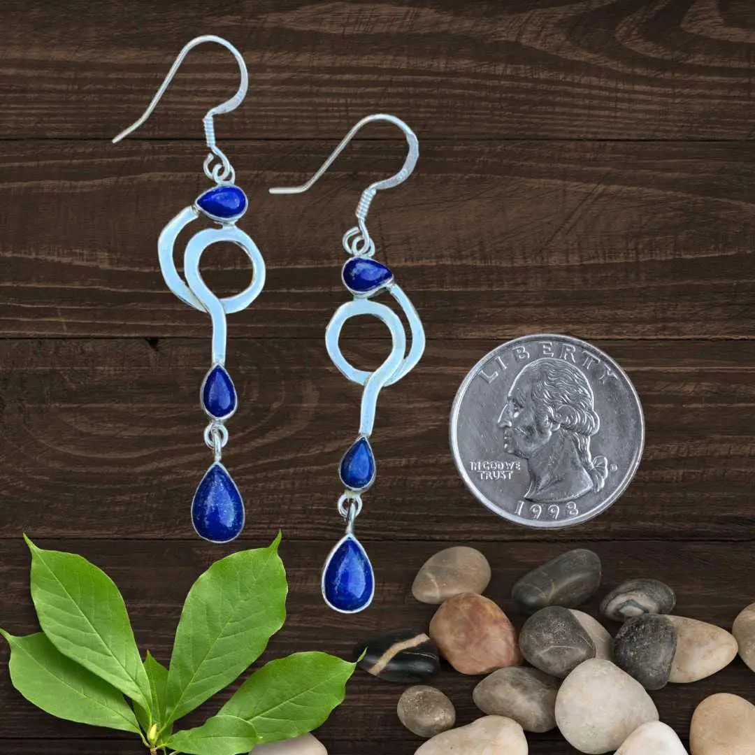 an image of a pair of dangly Triple Teardrop Lapis Lazuli and Sterling Silver Earrings next to a quarter