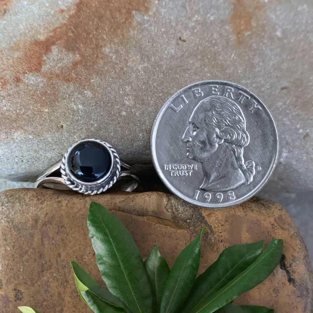 an image of a Round Black Onyx and Sterling Silver Ring next to a quarter