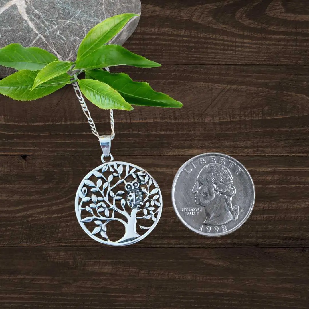 an image of a Sterling Silver Owl in Tree Pendant next to a quarter