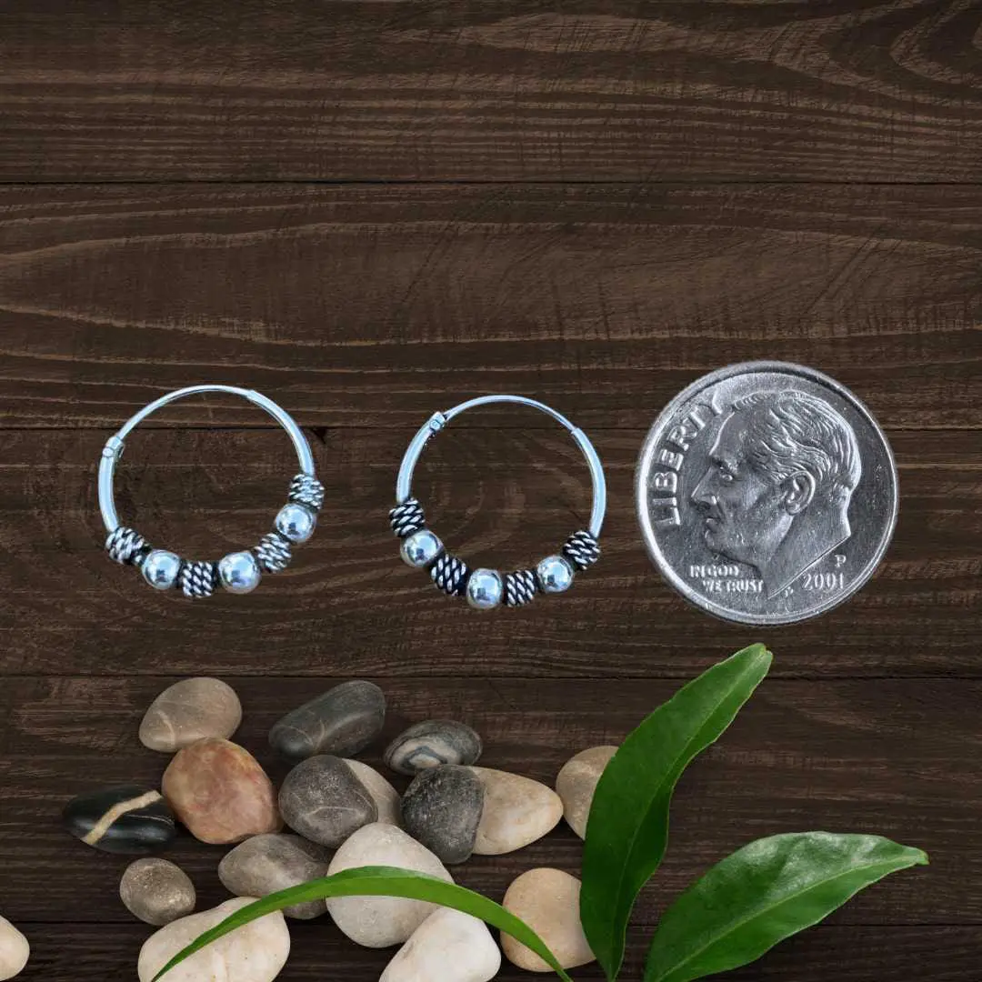 an image of a pair of Mini Three Ball Bali Sterling Silver Hoop Earrings next to a dime
