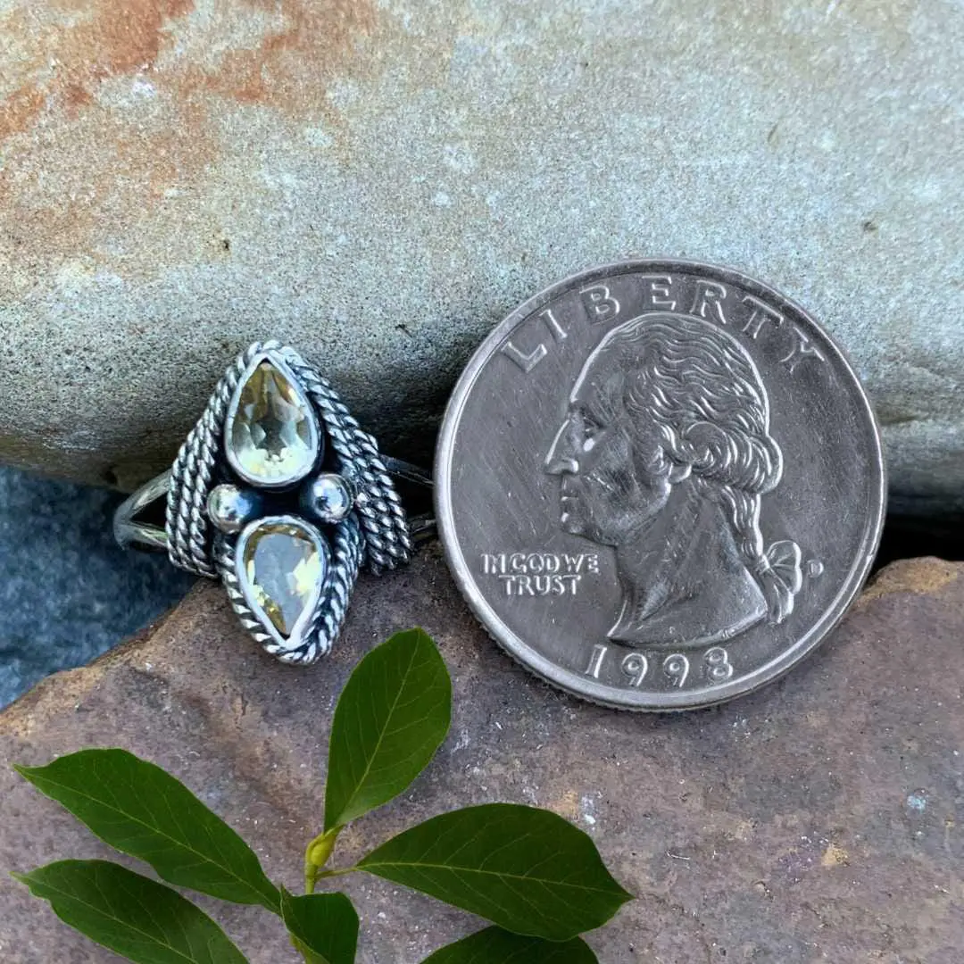 an image of a Double Faceted Citrine and Sterling Silver Ring next to a quarter