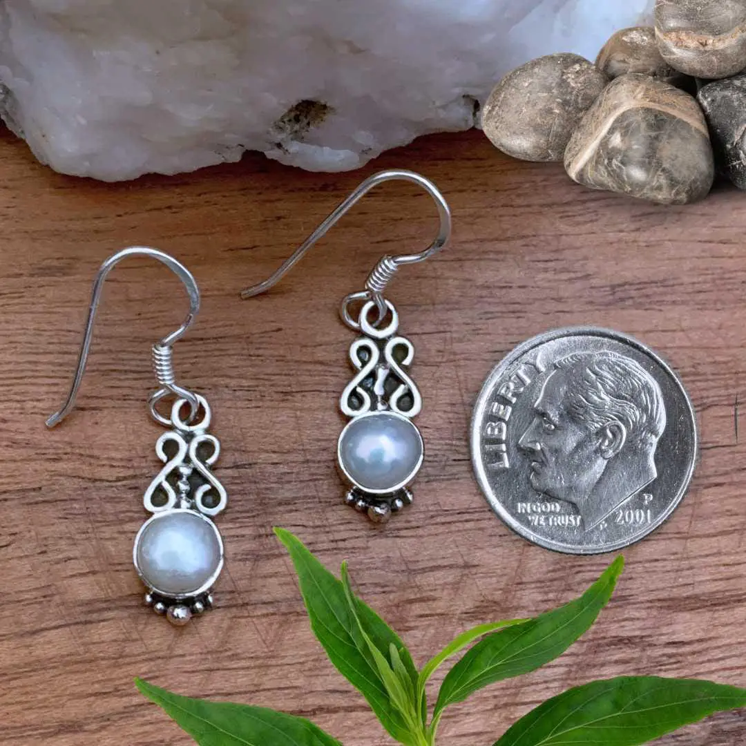 an image of a pair of Dainty Round Pearl and Sterling Silver Earrings next to a dime