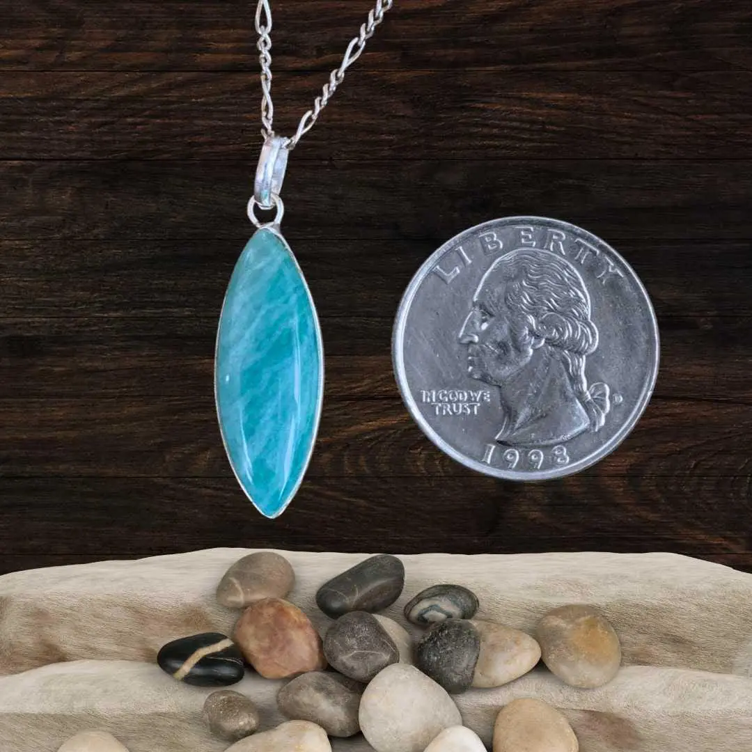 an image of a Marquise Amazonite and Sterling Silver Pendant next to a quarter