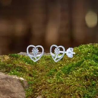 an image of a sterling silver sunflower in an open sterling silver heart stud earrings