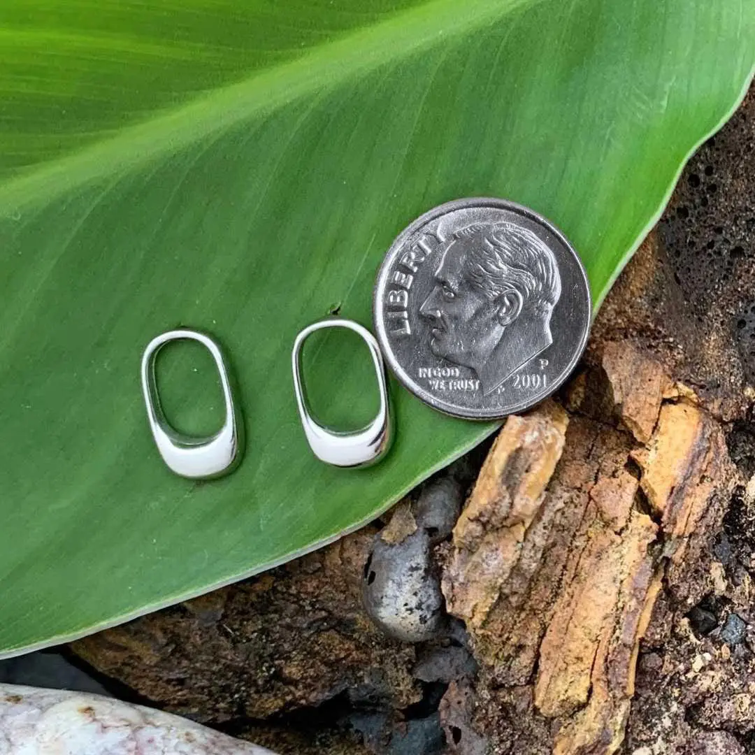 an image of a pair of Open Oval Sterling Silver Stud Earrings next to a dime