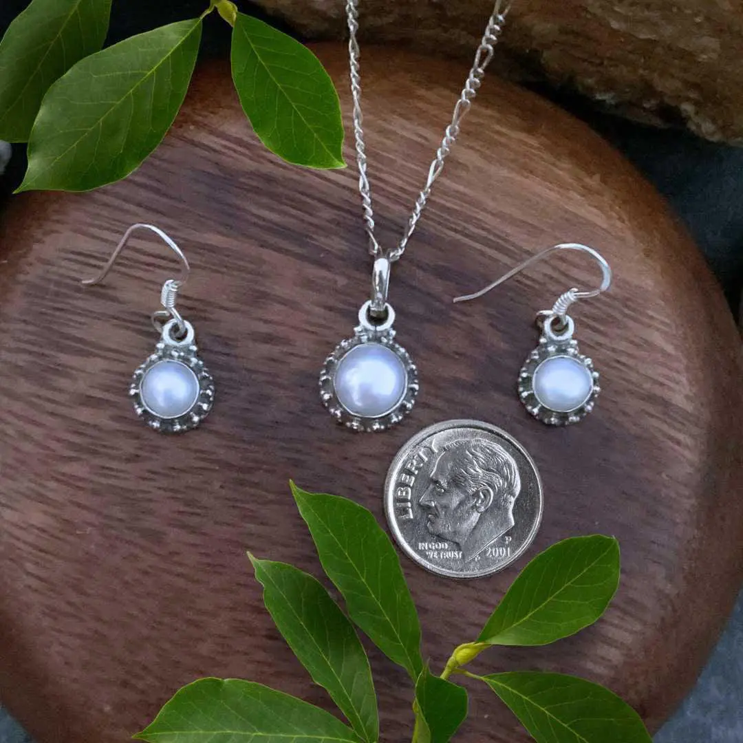 an image of a Dainty Sterling Silver and Pearl Pendant and Earrings Set next to a dime
