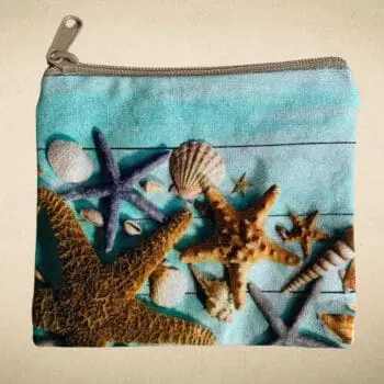 an image of a Seashells and Starfish Coin Purse made of heavy cotton canvas type material and a zipper.