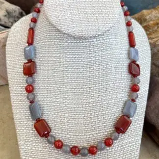 an image of a Carnelian and Grey Agate Beaded Necklace with a mix of square, round and tube shaped beads.