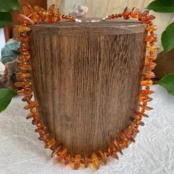 an image of an Amber Chips and Beads Necklace with sterling silver lobster clasp and beads at closure