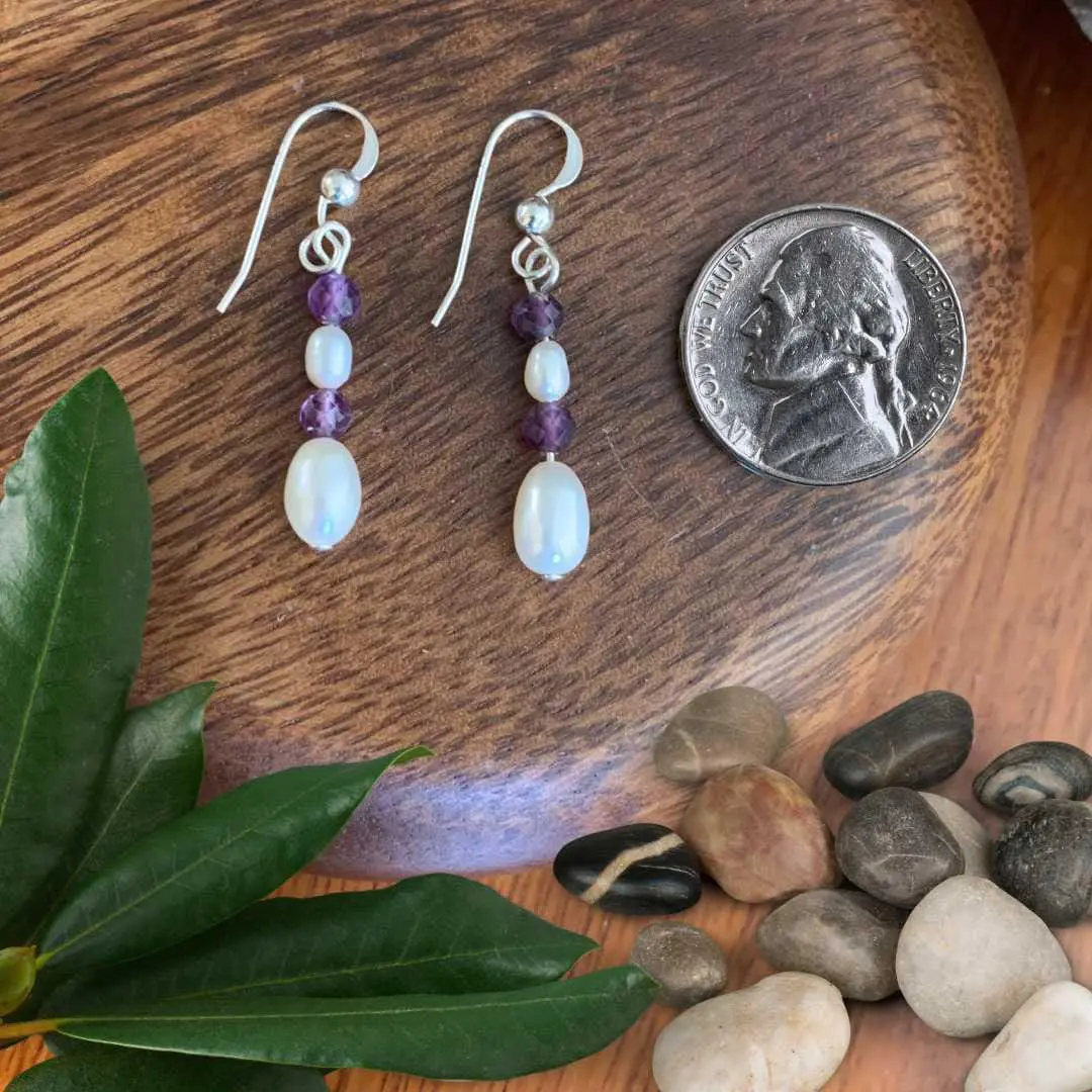 an image of a pair of Pearl and Amethyst Sterling Silver Earrings next to a nickel