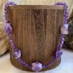 an image of a Amethyst Beaded Statement Necklace featuring 5 large amethyst focal pieces spaced between 6mm round amethyst beads