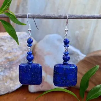 an image of a pair of Square Lapis Lazuli Beaded Earrings showing a square lapis bead on the bottom with smaller rondelle and round beads and a small silver bead from Karen Hill Tribe