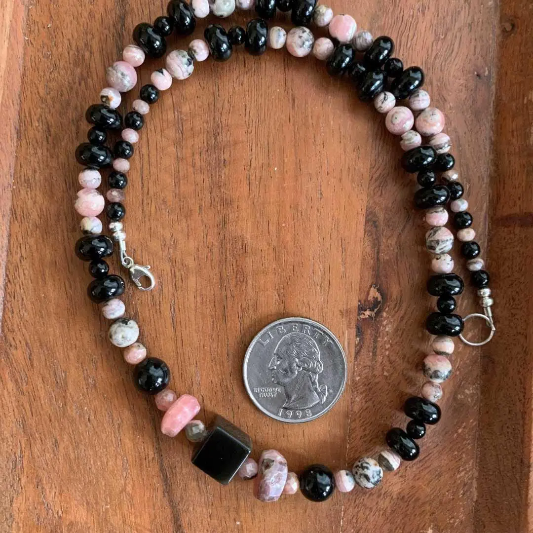 an image of a Rhodochrosite and Black Onyx Beaded Necklace next to a quarter