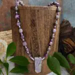 an image of an Atlantisite Stichtite with Hematite and Sterling Silver Necklace featuring an Atlantisite Stichtite point pendant