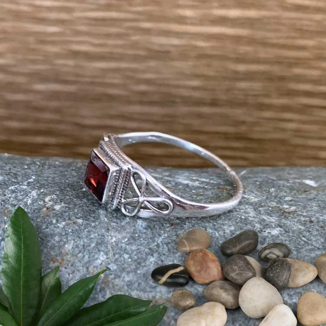 an image of a side view Dainty Square Garnet and Sterling Silver Ring