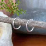 an image of a pair of Tiny Plain Sterling Silver Hoop Earrings
