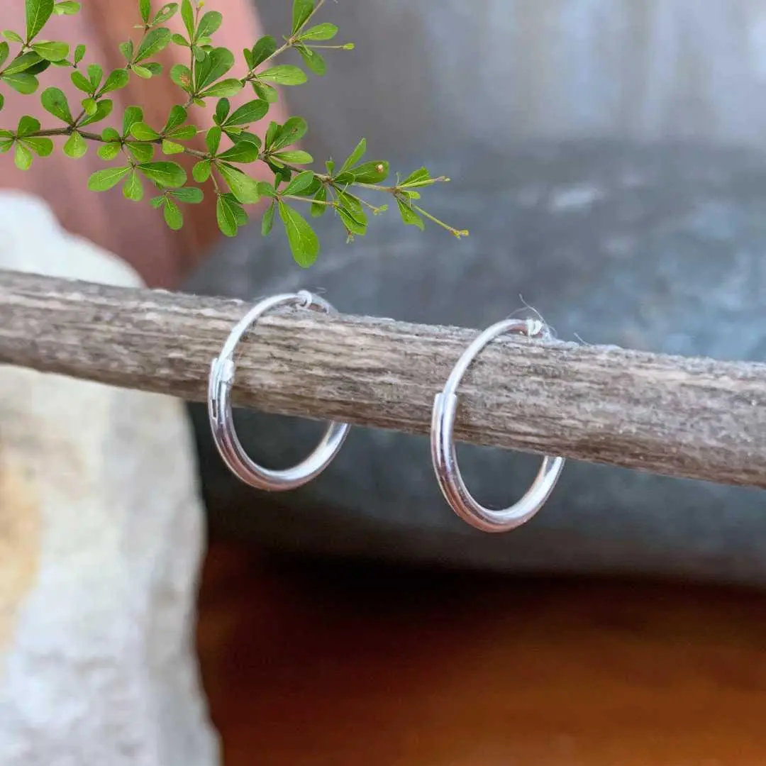 an image of a pair of Tiny Plain Sterling Silver Hoop Earrings