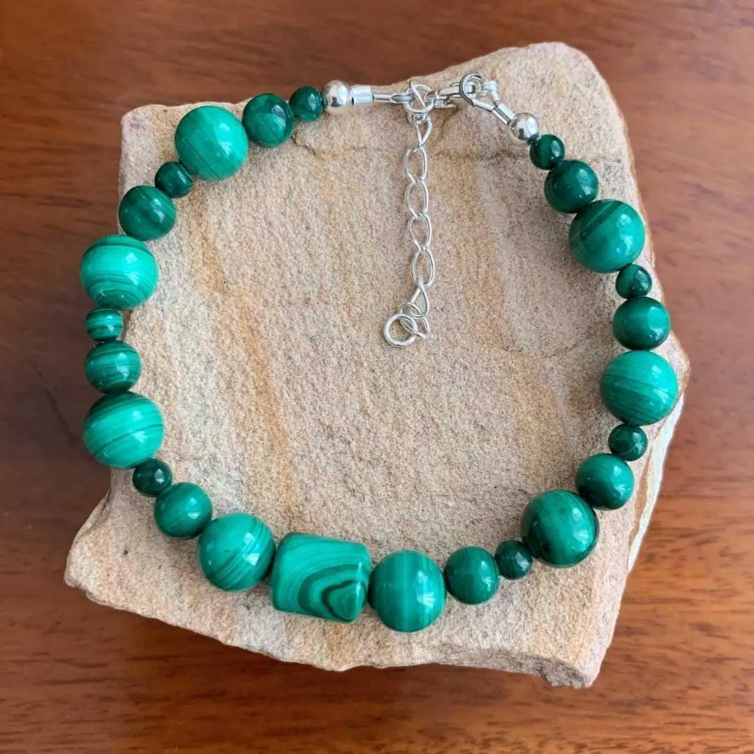 an image of a Assorted Round and Barrel Beaded Malachite Bracelet with sterling silver beads and lobster clasp on ends